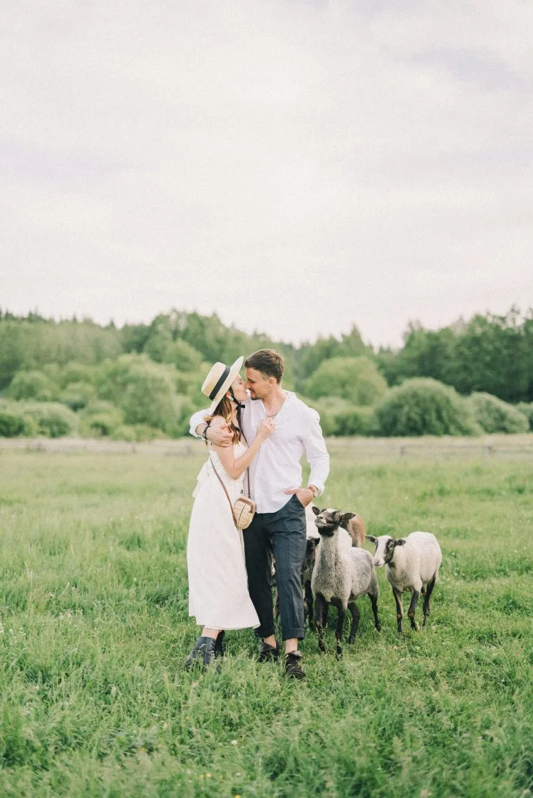 man and woman enjoying a romantic moment in a field with sheep - benefits of quitting porn